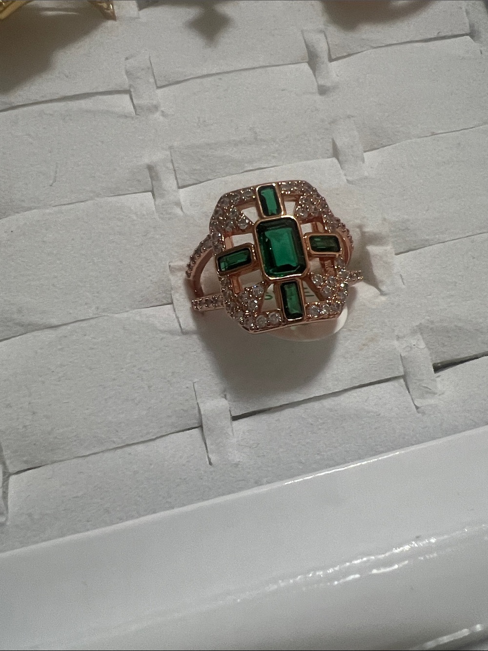 Elegant Rose Gold Ring with Emerald Green Stones
